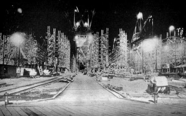 BUILDING SHIPS UNDER ARTIFICIAL LIGHT AT HOG ISLAND SHIPYARD