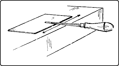 Fig. 157. Resharpening a Cabinet-Scraper: Flattening the Edge.