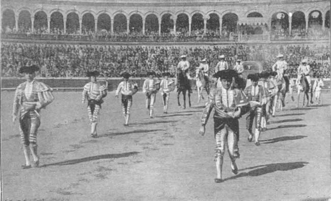 THE GORGEOUSLY DRESSED MATADORS ENTERING THE ARENA.