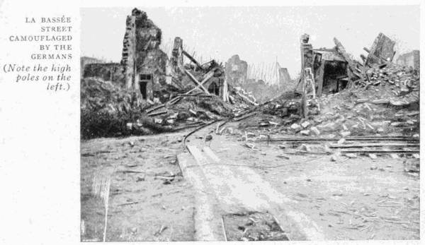 LA BASSE.
STREET CAMOUFLAGED BY THE GERMANS
(Note the high poles on the left.)