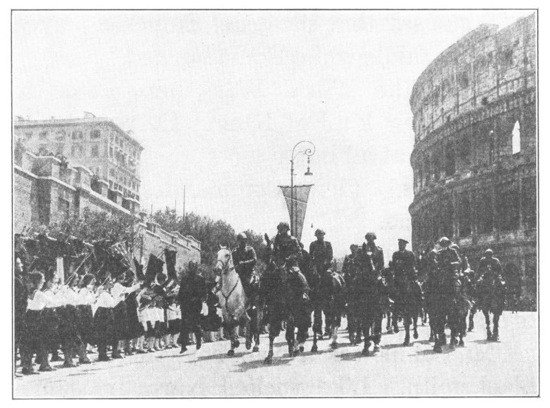 A PARADE PASSING THE COLOSSEUM: ROME