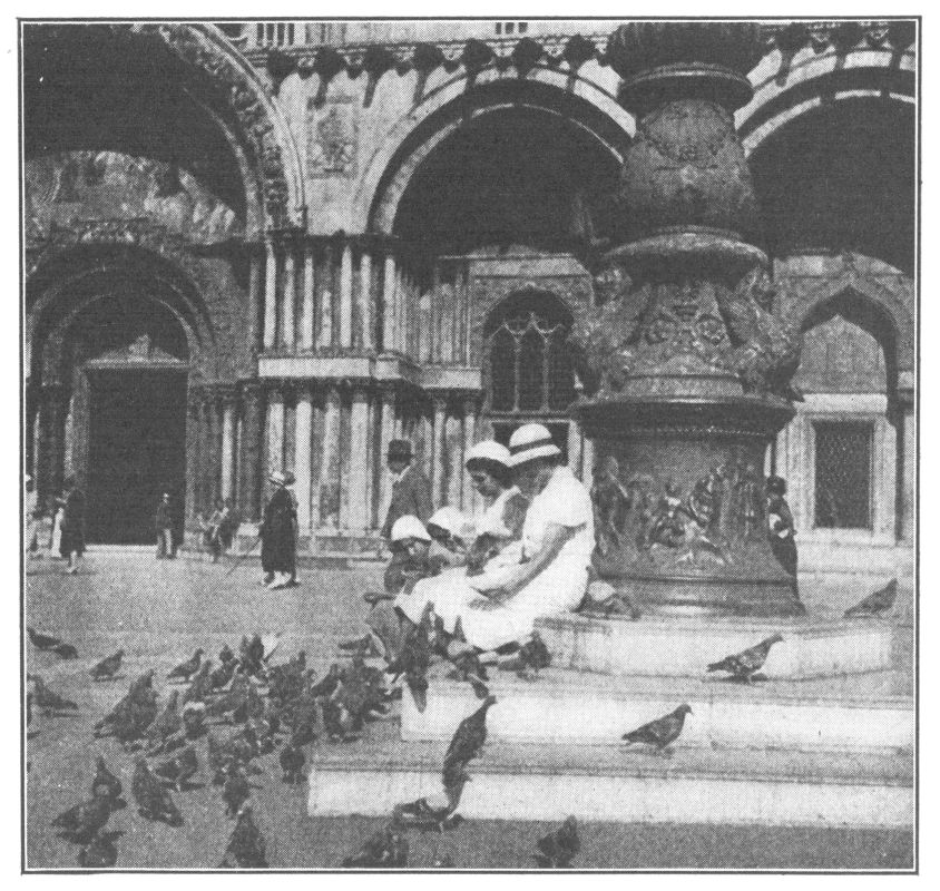 FEEDING PIGEONS IN ST. MARK'S SQUARE