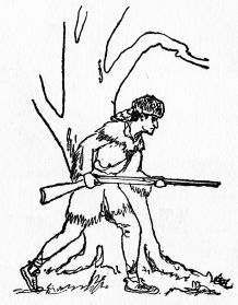 man holding rifle hiding behind tree